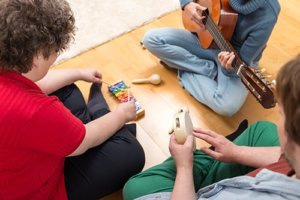 A group of teens participate in music therapy in Los Angeles CA