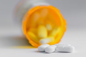 a bottle of pills represents a codeine addiction treatment program