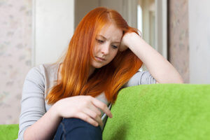 A girl thinks about her issues during cognitive behavioral therapy for bipolar disorder