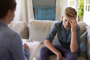 A teen boy learns about the comorbidity of his substance abuse and mental health disorders during treatment