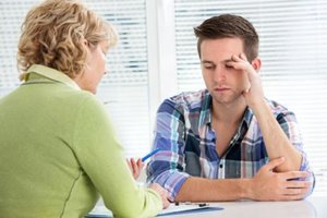 teen and counselor reviewing a crystal meth addiction treatment program