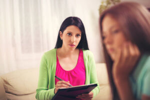A teen girl participates in a psychotherapy program