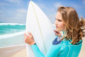 A teen girl participates in surf therapy in Los Angeles CA